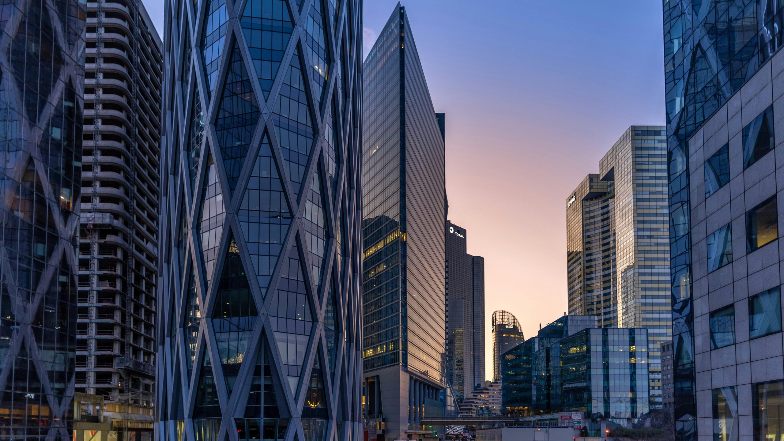 Capture of modern skyscrapers in Paris during sunset, showcasing urban architecture.